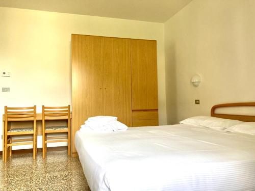 Ein Bett oder Betten in einem Zimmer der Unterkunft Hotel Zanetti