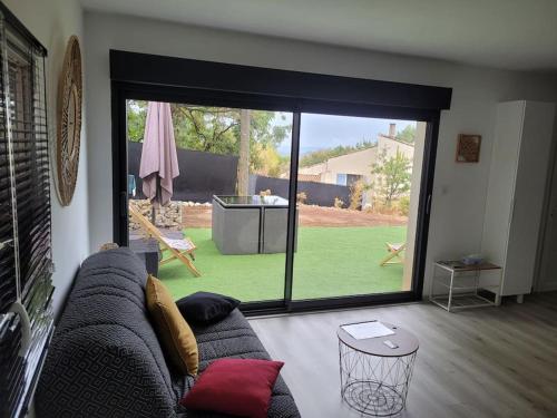 Posedenie v ubytovaní Appartement tout équipé en rez-de-jardin entre Gard et Ardèche