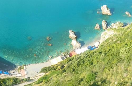 a view of a beach with rocks in the water at Grand Hotel San Michele in Cetraro
