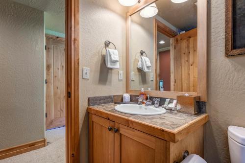 a bathroom with a sink and a mirror at Lodges at Deer Valley - #2220 in Park City