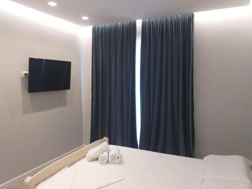 Katil atau katil-katil dalam bilik di Emily Boutique Hotel