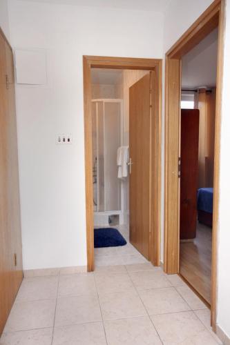 a hallway with a door open to a room at Apartments with parking space Slatine, Ciovo - 6061 in Slatine