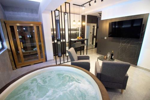 a room with a hot tub in the middle of a room at Jacuzzi Sauna SelfCheckIn Mystic in Mostar