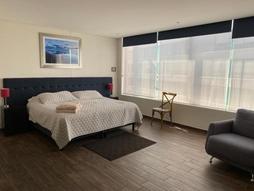 Ένα ή περισσότερα κρεβάτια σε δωμάτιο στο Napoles Suites