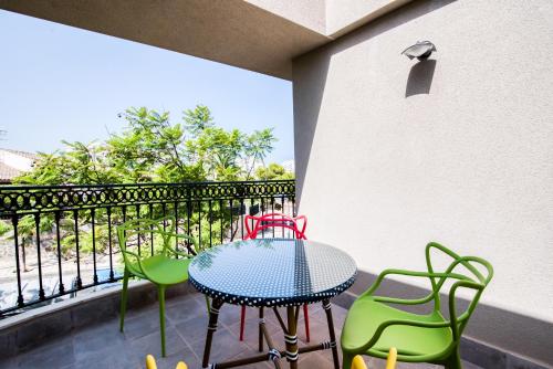 a patio with a table and chairs on a balcony at Mar Apartments Alicante, Playa de San Juan in Alicante