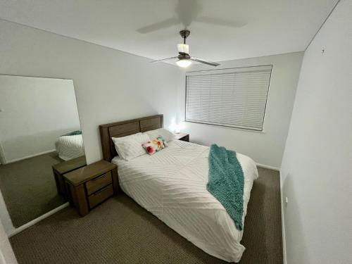 a bedroom with a bed with a teddy bear on it at H2O Holiday Apartments Unit 4 in North Haven