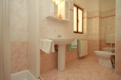 a bathroom with a sink and a toilet at Apartment Rabac 7429a in Rabac