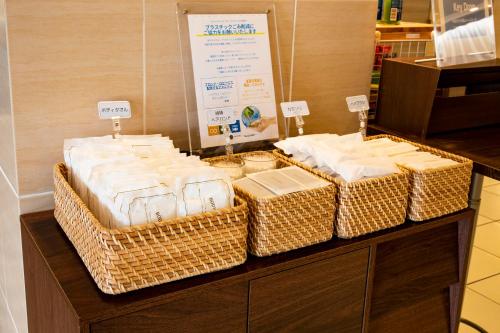 a group of wicker baskets sitting on top of a counter at Court Hotel Mito in Mito
