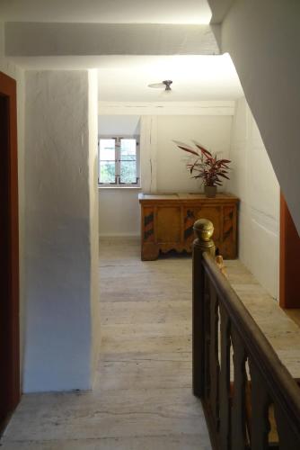 a hallway with a staircase in a house at Ickelhaus 2 in Bad Windsheim