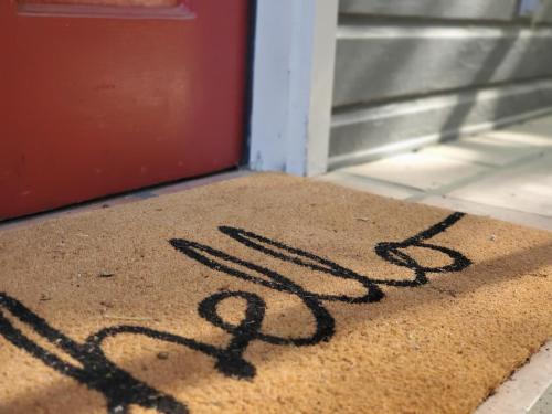 a door mat with the word exit written on it at Cheerful 2 BR Near Colleges, Downtown, Attractions in Montgomery