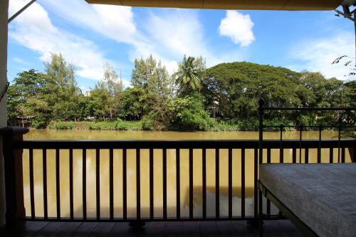 a view of a river from a balcony at Baan Luang Rajamaitri Historic Inn in Chanthaburi