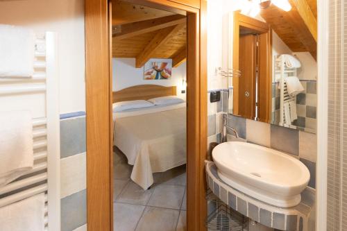 a bathroom with a toilet and a sink in a room at B&B Il Vicoletto Del Casale in Centola