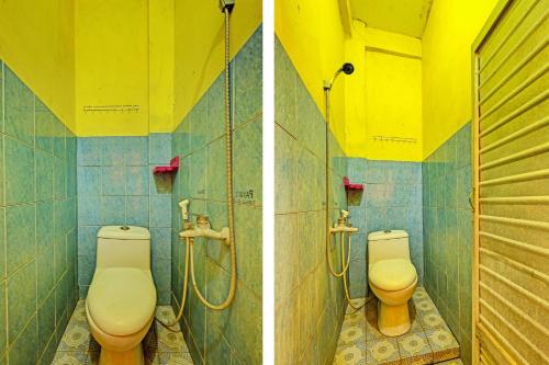 two toilets in a bathroom with yellow and blue tiles at SPOT ON 91540 Ukuh Guesthouse in Prambanan