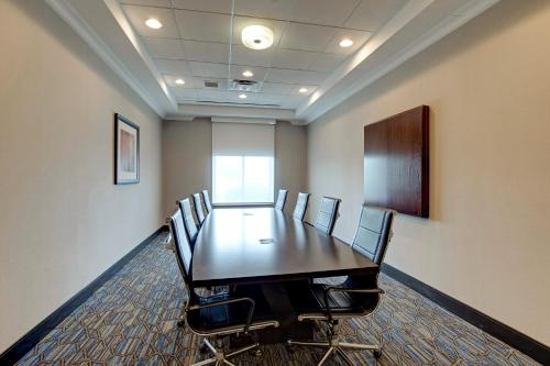 a conference room with a long table and chairs at Holiday Inn Express Nashville-Opryland by IHG in Nashville