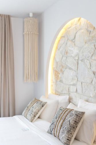 Ένα ή περισσότερα κρεβάτια σε δωμάτιο στο Amalthia Luxury Suites