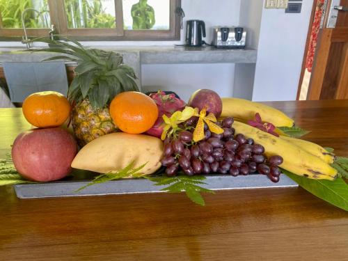 a pile of fruits and vegetables on a table at Phandara Luxury Pool Villas in Ko Tao