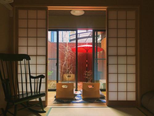 an entrance to a room with a window with boxes at Minami Toji---JP Style Guesthouse in Kyoto in Kyoto