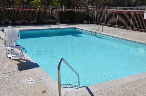a small swimming pool with a metal fence at Holiday Inn Express Brentwood-South Cool Springs, an IHG Hotel in Brentwood