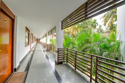 a corridor of a building with a balcony at Silver Sand Sentinel in Port Blair