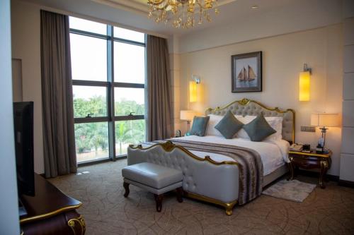 a bedroom with a large bed and a large window at Superior Room Space Available in Accra
