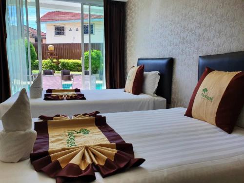 Postel nebo postele na pokoji v ubytování Retreat Resort Pattaya