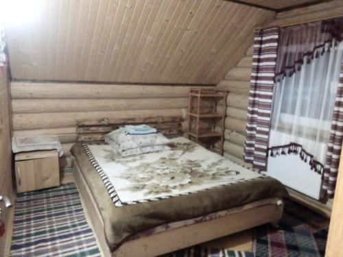 Postel nebo postele na pokoji v ubytování Cottage Лісовий