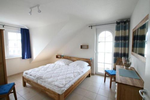 Ένα ή περισσότερα κρεβάτια σε δωμάτιο στο Villa Friederike App 05 - Flaschenpost