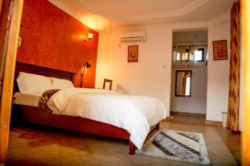 a bedroom with a large bed in a room at Samanene Hotel in Mwanza