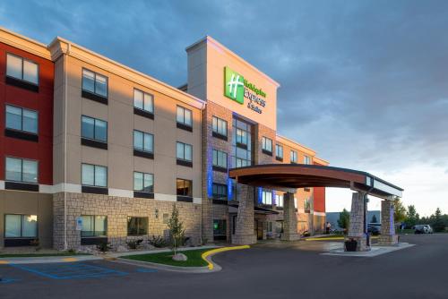an office building with a sign on the front of it at Holiday Inn Express Hotel & Suites Bismarck by IHG in Bismarck