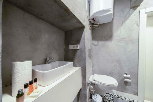 a bathroom with a sink and a toilet at Classy Furnished Studio in The Heart of Karaköy ( Karakoy 1 ) in Istanbul