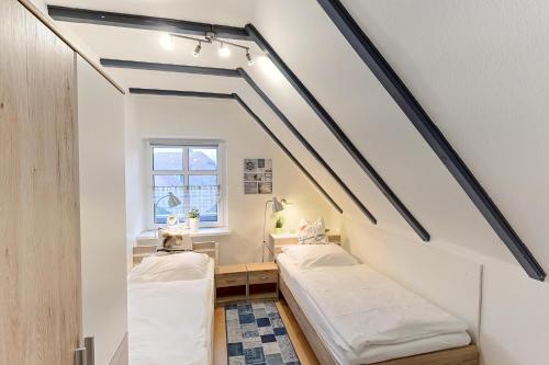 Postel nebo postele na pokoji v ubytování Huus vör d Diek Wohnung 6