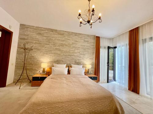 Ένα ή περισσότερα κρεβάτια σε δωμάτιο στο Vila Terase