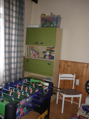 a room with a table with a toy gun on it at Alpenpension in Altaussee