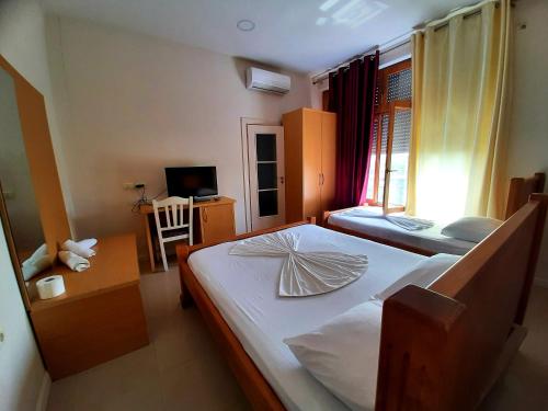 Un pat sau paturi într-o cameră la Hotel Vila Giorgio