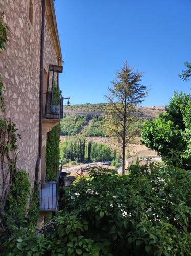 a view from the side of a building with plants at Hostal Posada La Panadera in Sepúlveda