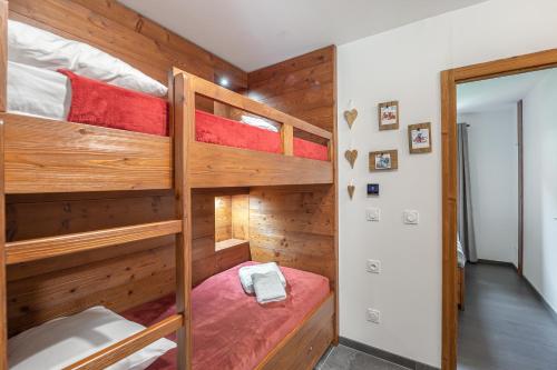 a bedroom with two bunk beds in a house at Quintessence Apt A301 - BO Immobilier - remises sur les forfaits de skis Châtel ou Portes du soleil in Châtel