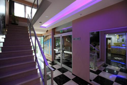 a staircase in a house with purple walls at Hotel Sofia in Bad Wildungen