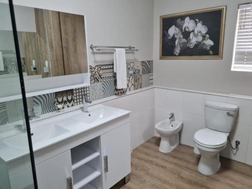 Et badeværelse på Point Village Accommodation - Beach Club 307