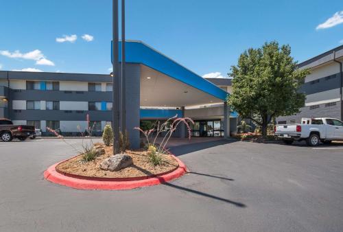 a parking lot in front of a building at Clarion Pointe OKC Airport in Oklahoma City
