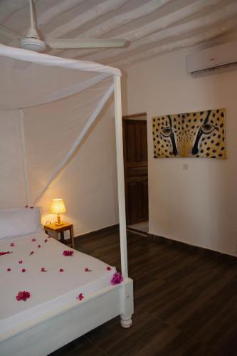 Ένα ή περισσότερα κρεβάτια σε δωμάτιο στο Bahati Villa