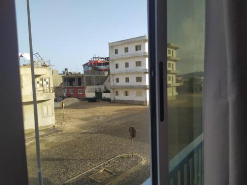 a view of a city street from a window at Apartamento T2 em Sal Rei - Boavista in Sal Rei