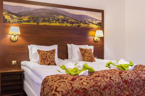 Posteľ alebo postele v izbe v ubytovaní Hotel Buczyński Medical & SPA