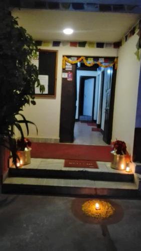 a hallway of a building with a room with lights at Best Hostel in Kathmandu
