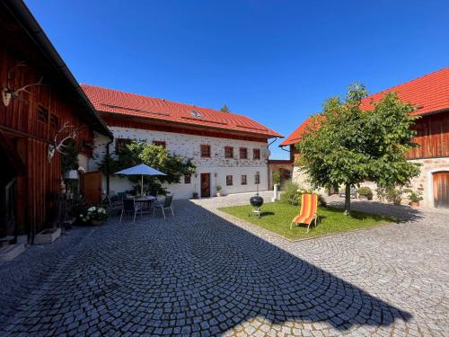 a cobblestone street in front of a building at Holiday Home Lehner im Wald - RZM100 by Interhome in Rutzenmoos