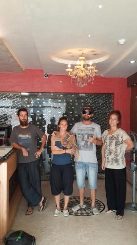 a group of people standing in a room at Hotel Eastern Plaza in Kolkata