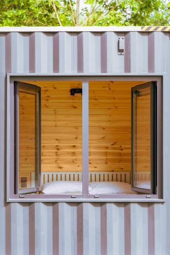a window in the side of a house at Arche Siedlisko Augustynka 59 in Nurzec