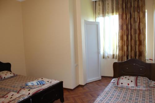 מיטה או מיטות בחדר ב-Guest House Gela