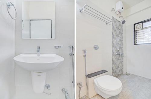 a white bathroom with a sink and a toilet at HOTEL EXECUTIVE INN in Hailākāndi