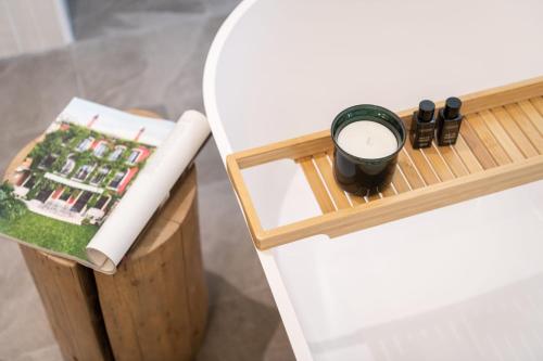 a table with a tray with a candle and a book at Cabana Bistrita in Durau