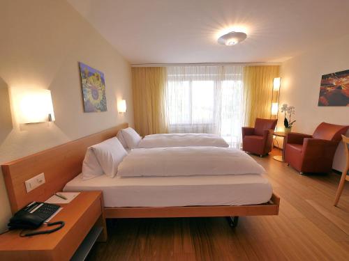 Un pat sau paturi într-o cameră la Hotel Restaurant Eichberg
